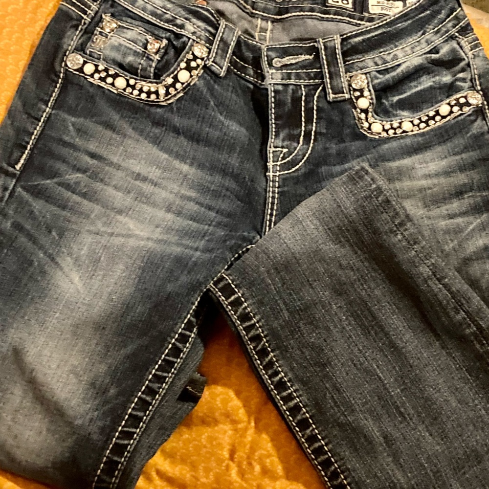 Size 26 , mid rise, boot cut Miss Me jeans.